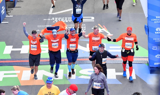 FredsTeamMark founders crossing the NYC Marathon finish line together